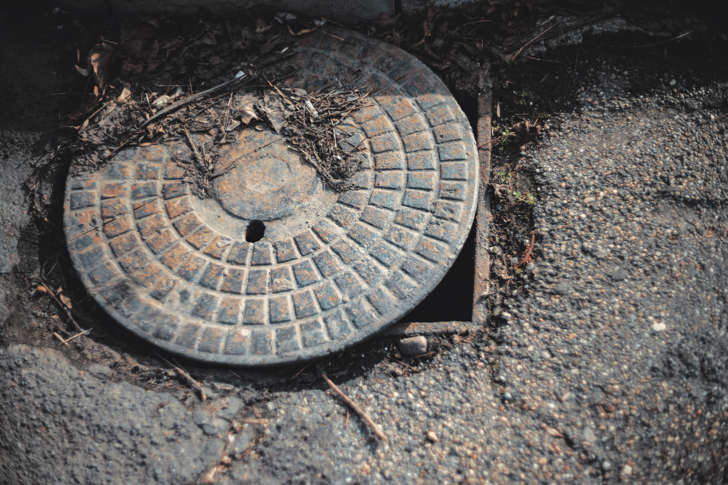 Abandoned Rusty Sewer Manhole Cover For The Sewer Drainage System